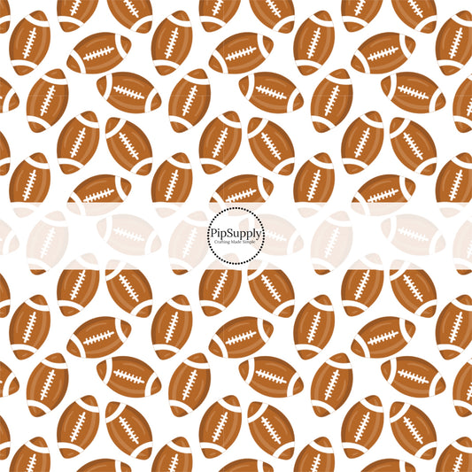 Brown and White scattered footballs on white fabric by the yard.