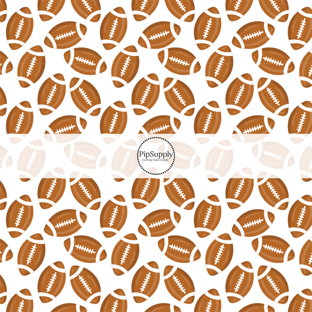 Brown and White scattered footballs on white fabric by the yard.