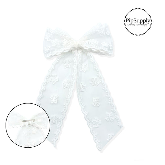 large white tulle bow with bow shaped stitching