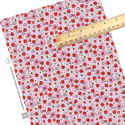 These Valentine's pattern themed faux leather sheets contain the following design elements: red, white, and pink flowers surrounded by red strawberries and tiny white stars on light pink. Our CPSIA compliant faux leather sheets or rolls can be used for all types of crafting projects.