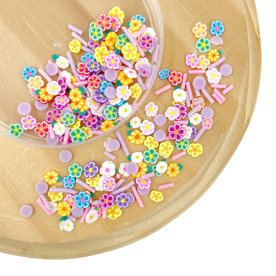 Floral and sprinkle clay pieces. Used as filling for shaker bows, resin crafting, slime additives &amp; so much more!

This loose clay mix is sold in a resealable 1 oz Bag

- Material: Polymer Clay and Glitter
