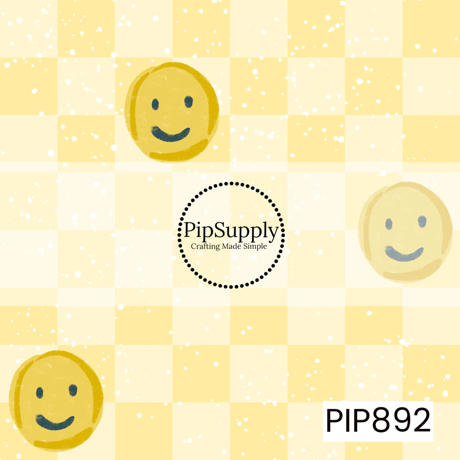 A cheerful summer-inspired pattern featuring scattered hand-drawn smiley faces in warm golden yellow tones across a soft tonal yellow checkerboard background. White paint-splatter accents are sprinkled throughout, adding playful texture and movement. The smiley faces have a casual, doodled appearance with a lightly distressed finish, creating a fun, retro aesthetic. Bright, happy, and nostalgic, this design captures carefree sunshine, positivity, and summertime charm.
