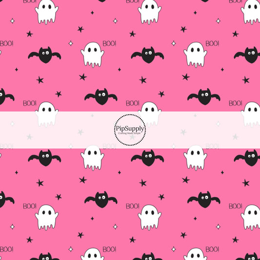 Ghosts, Bats, stars, and the word "BOO!" on hot pink fabric by the yard.