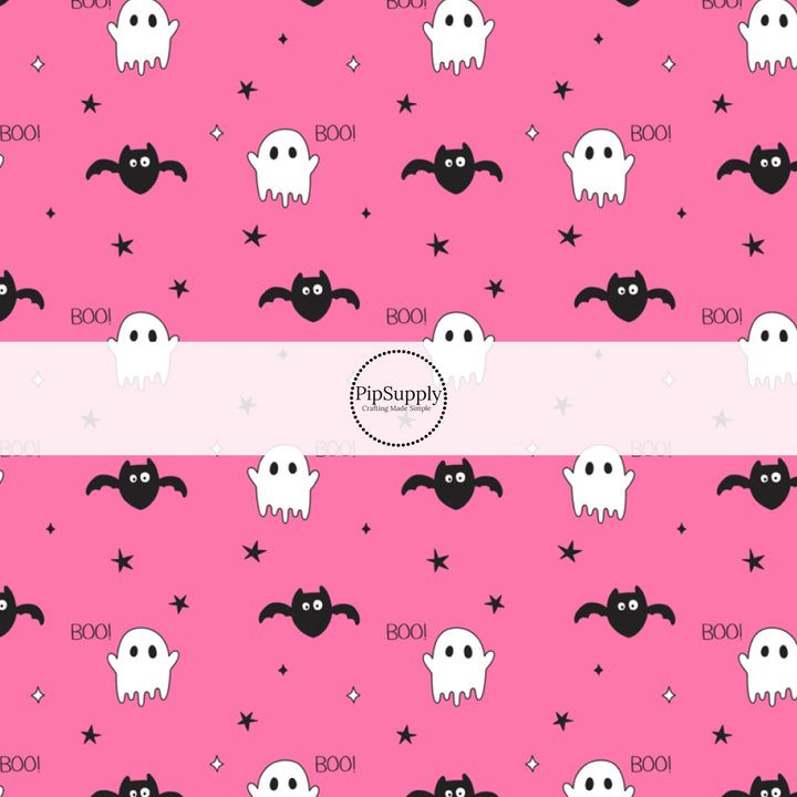 Ghosts, Bats, stars, and the word "BOO!" on hot pink fabric by the yard.