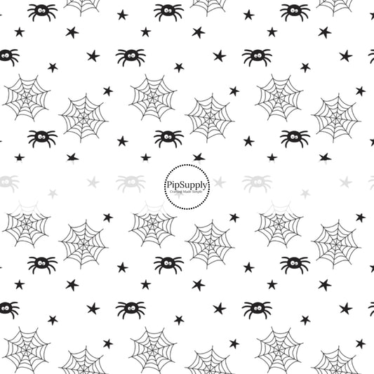 Spiders, spider webs, and stars on white fabric by the yard.