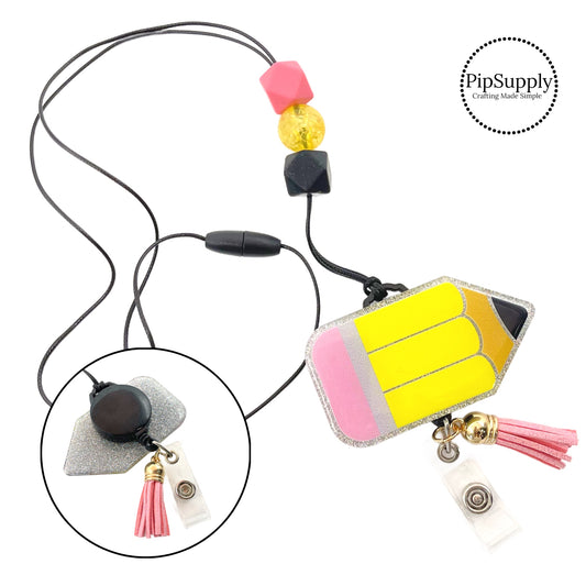 This school pencil pendant necklace makes a wonderful lanyard gift for a teacher. The necklace features a yellow pencil pendant, 3 beads, and pink tassel with clear badge clip.