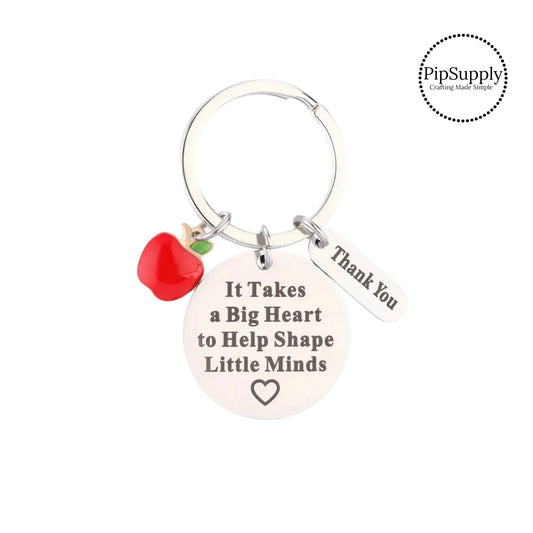 Red apple charm and gratitude charms on a round silver keychain ring. The teacher appreciation charms have the following phrases: "Thank You" and "It Takes A Big Heart To Help Shape Little Minds." These silver key chains are perfect to add to your everyday key ring or give as a gift to a teacher!! These are ready to use or sell to others.