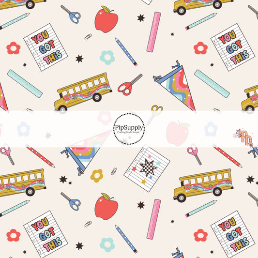 Cream fabric by the yard with school buses, school supplies, and flowers.