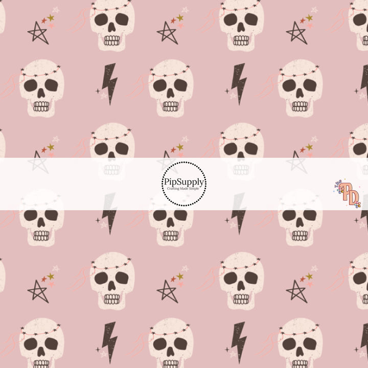 Light purple fabric by the yard with skulls, lightning bolts, and stars.