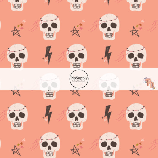 Skeletons and Stars on peachy-pink fabric by the yard.