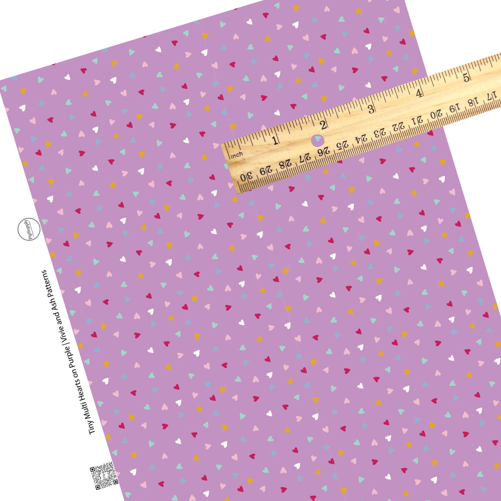 These Valentine's pattern themed faux leather sheets contain the following design elements: tiny multi colored hearts on purple. Our CPSIA compliant faux leather sheets or rolls can be used for all types of crafting projects.