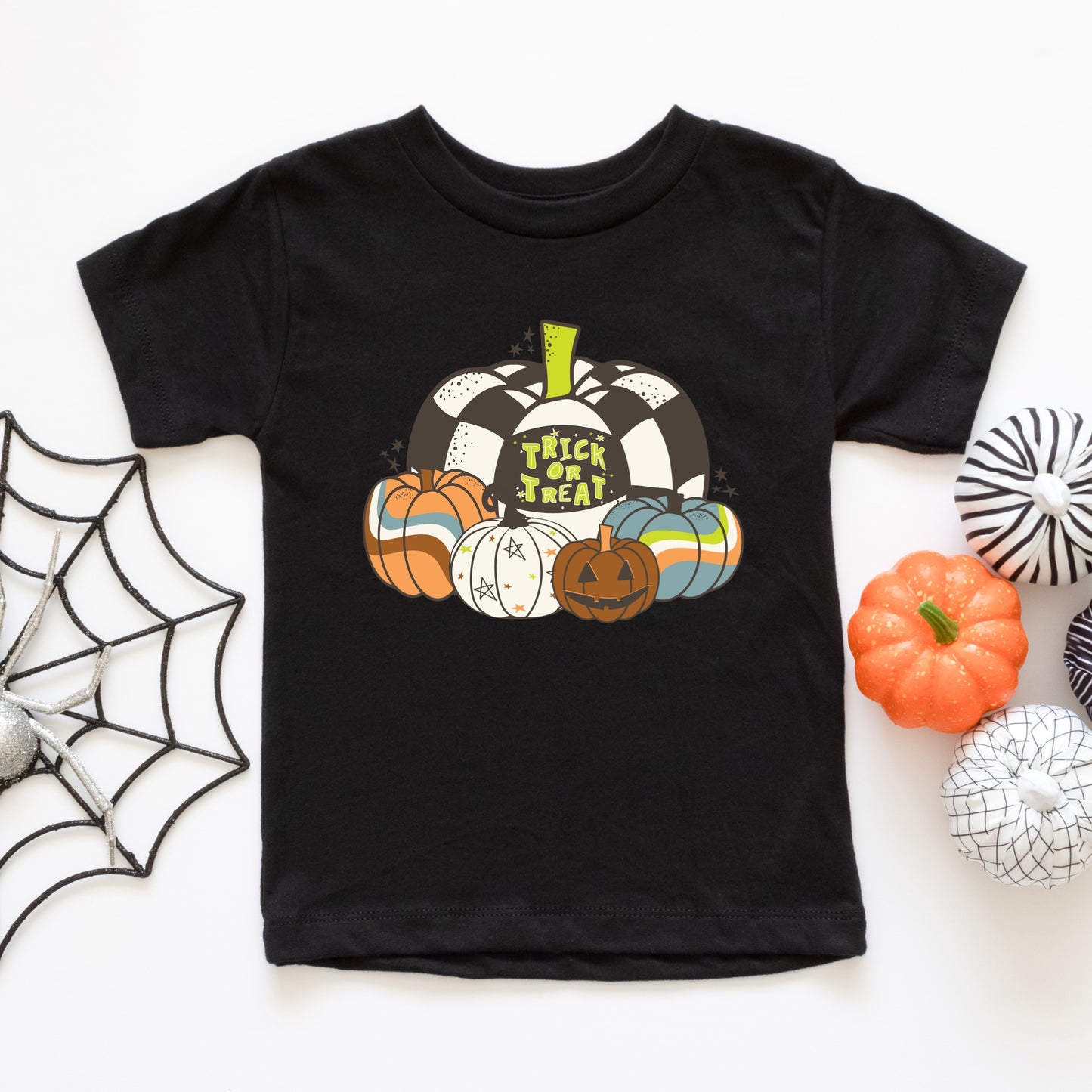 Groovy pumpkins and jack-o-lantern iron on heat transfer with the phrase "Trick or Treat".