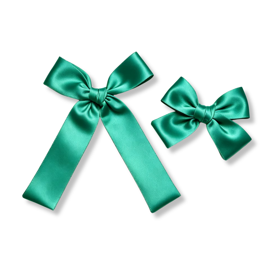 These classic satin bows feature a rich emerald green color and a smooth, luxurious sheen. Crafted with beautifully shaped loops, neatly wrapped center knots, and elegant tails, they offer a timeless look that combines sophistication with vibrant color. Perfect for everyday wear, holidays, special occasions, or adding a polished finishing touch to any hairstyle. 
Small Bow Sizing 4.5" x 4.5"
Large Bow Sizing 5.5" x 7"
