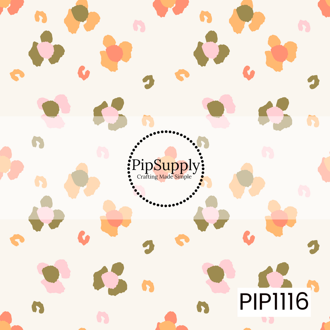 A soft, scattered floral pattern featuring abstract blossoms and playful brushstroke accents in blush pink, peach, coral, and olive green on a warm cream background. This simple, modern coordinate adds a sweet touch with a light, hand-painted feel.
