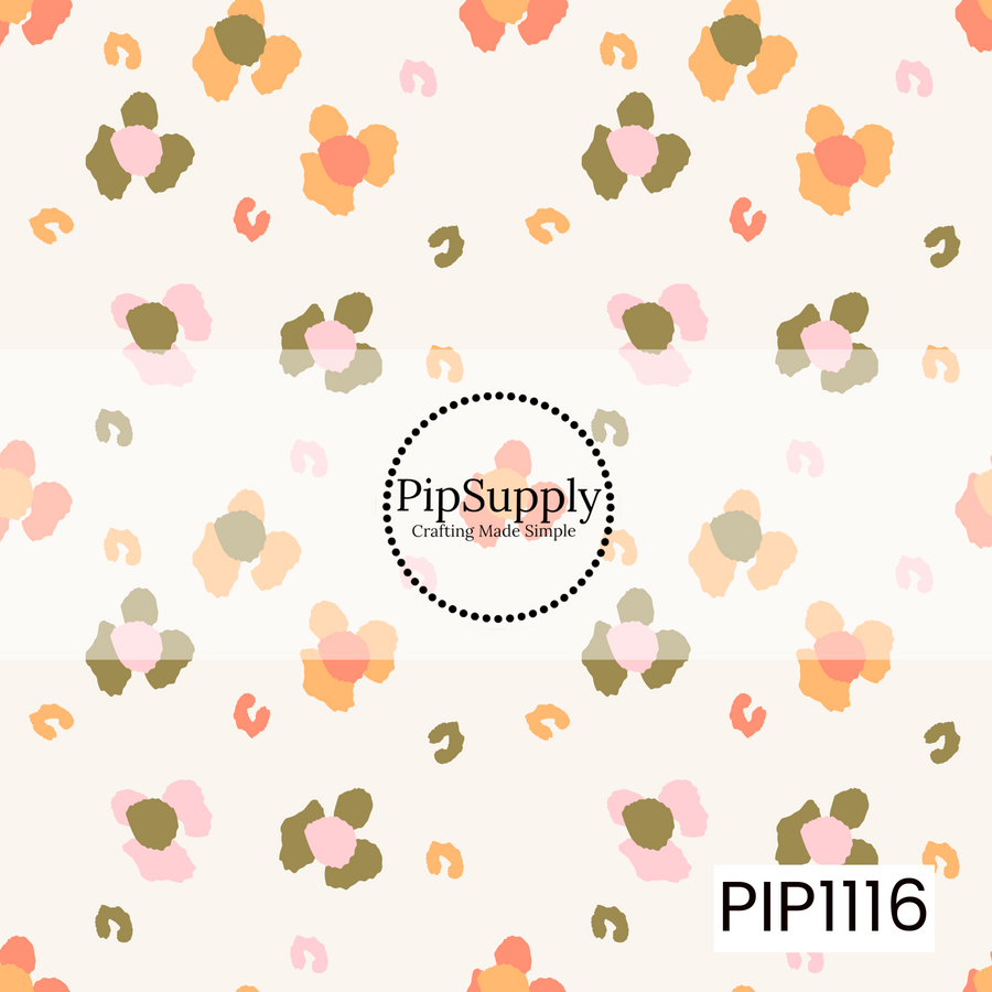A soft, scattered floral pattern featuring abstract blossoms and playful brushstroke accents in blush pink, peach, coral, and olive green on a warm cream background. This simple, modern coordinate adds a sweet touch with a light, hand-painted feel.
