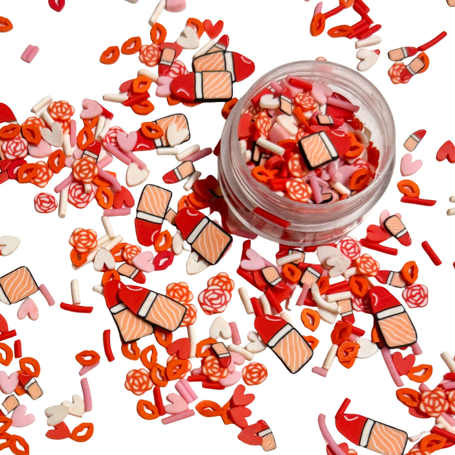 This pink and red clay slices mix is versatile for many craft projects. This Valentine's Day mix has lipstick, kisses, sprinkles, hearts, and roses. You can use it to add sparkle and decoration to resin projects, filling for shaker bows, slime making, party decor, scrapbooking, card making and nail art.