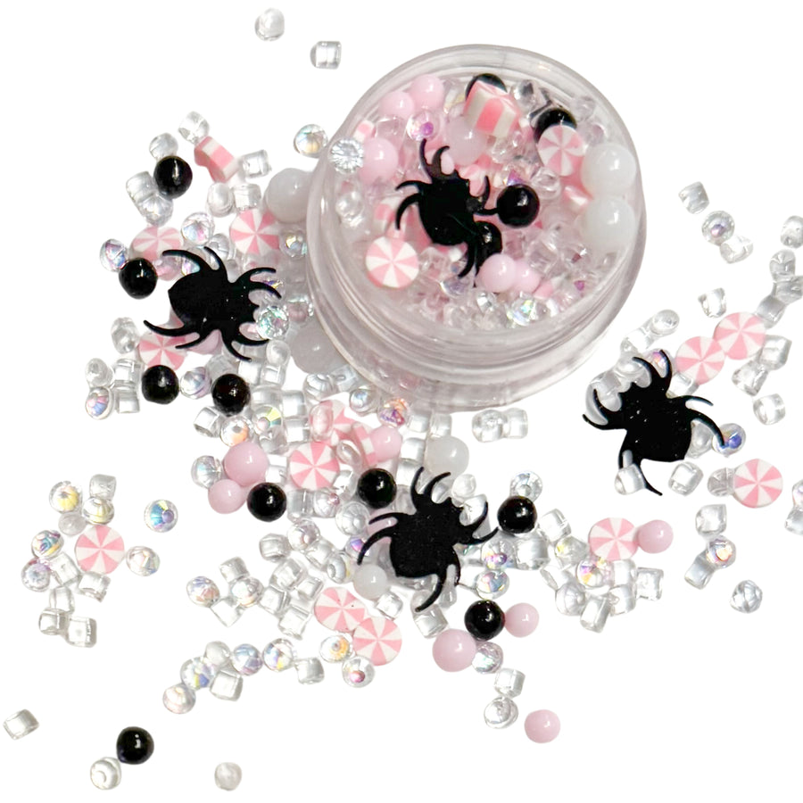 This pink and white clay slices mix is versatile for many craft projects. This Halloween mix has spiders, rhinestones, beads, and candy. You can use it to add sparkle and decoration to resin projects, filling for shaker bows, slime making, party decor, scrapbooking, card making and nail art.