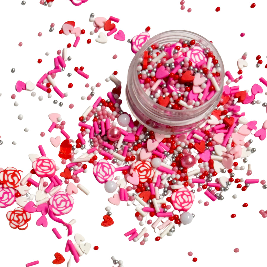 This pink and red clay slices mix is versatile for many craft projects. This Valentine's Day mix has sprinkles, hearts, roses, beads, and pearls. You can use it to add sparkle and decoration to resin projects, filling for shaker bows, slime making, party decor, scrapbooking, card making and nail art.