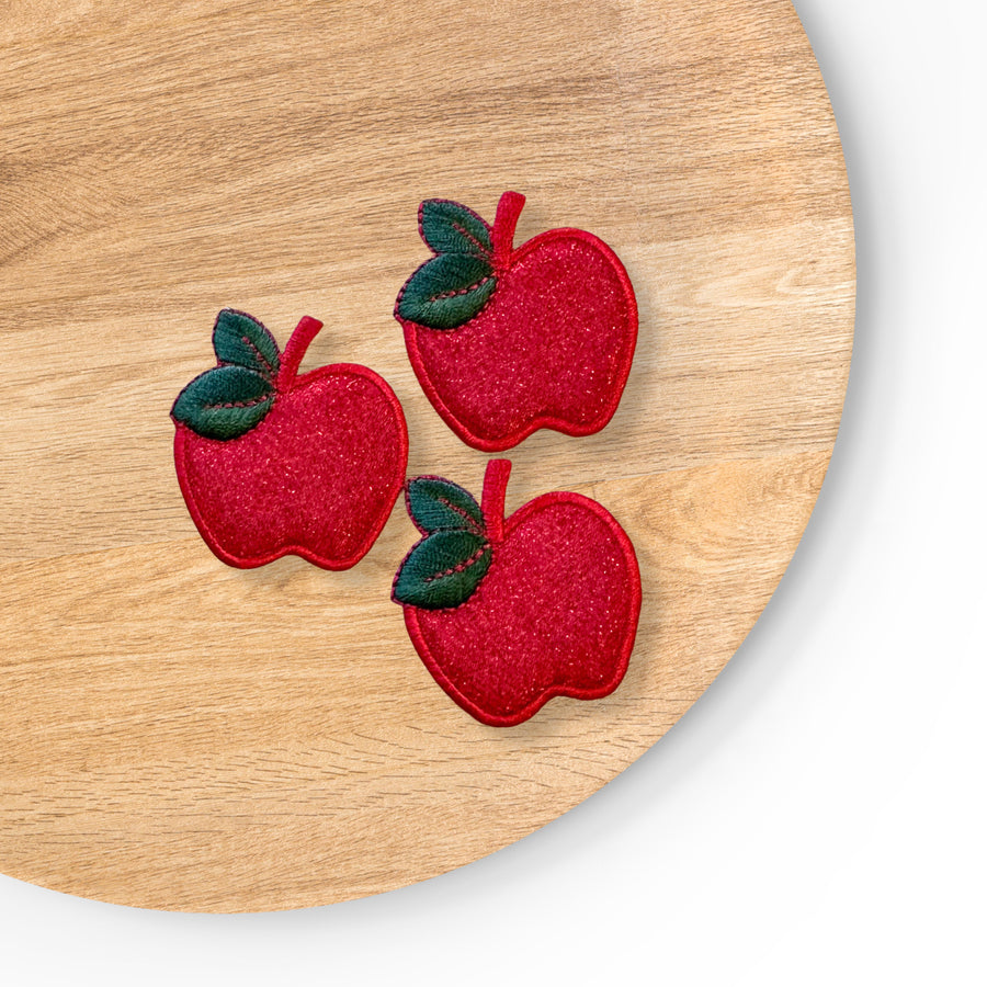 red sparkle apple with green leaf iron on