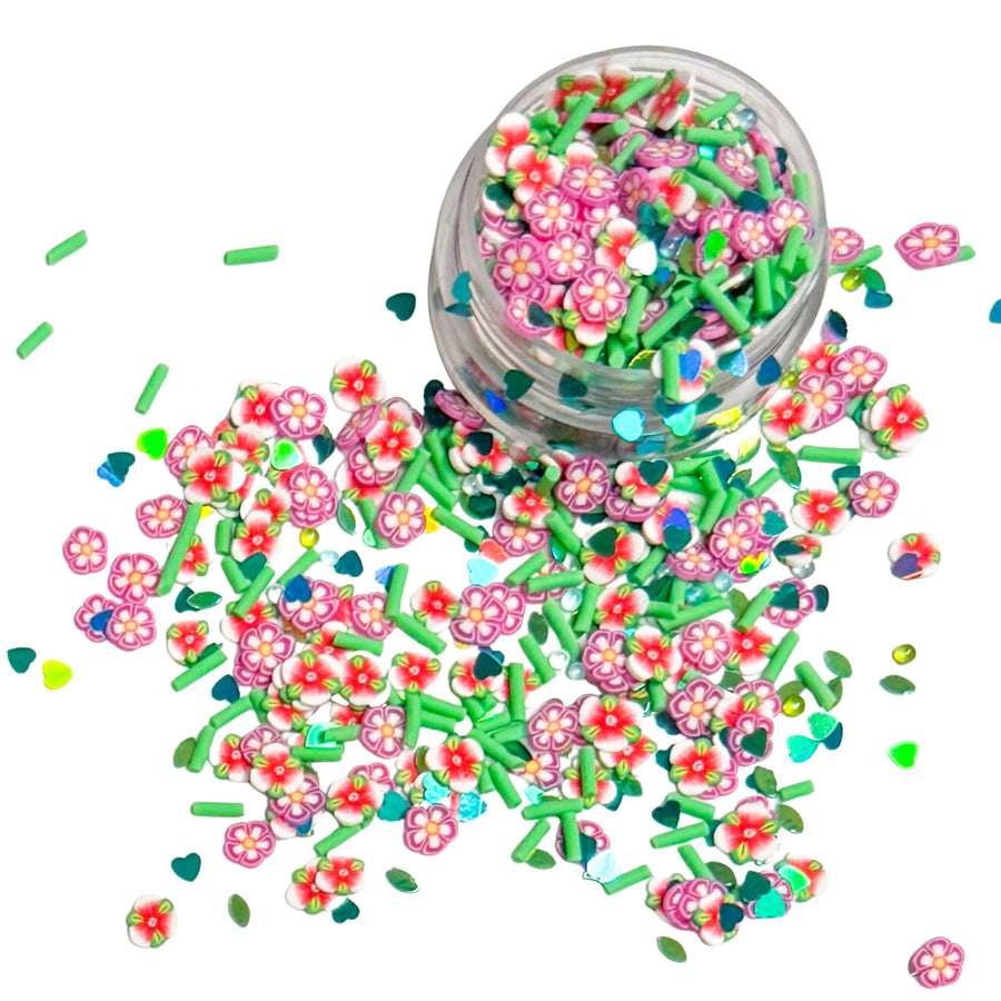 This princess inspired clay slice mix is versatile for many craft projects. This Hawaiian mix has Hawaiian flowers, sprinkles, and hearts. You can use it to add sparkle and decoration to resin projects, filling for shaker bows, slime making, party decor, scrapbooking, card making and nail art.
