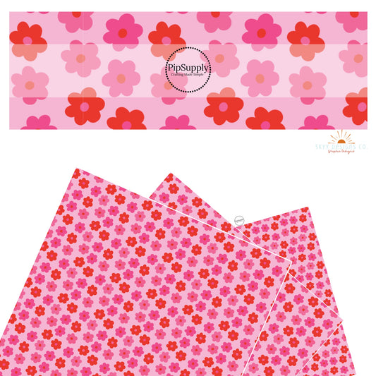 These Valentine's pattern themed faux leather sheets contain the following design elements: red and pink daisies on pink. Our CPSIA compliant faux leather sheets or rolls can be used for all types of crafting projects.