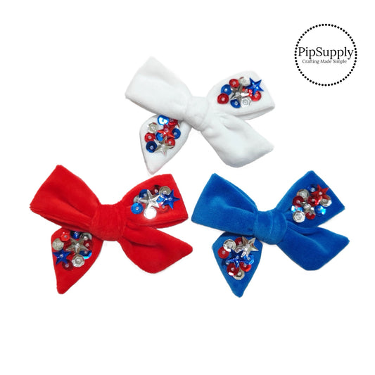 red blue and white velvet tied bows with hand sewn sequins and beads