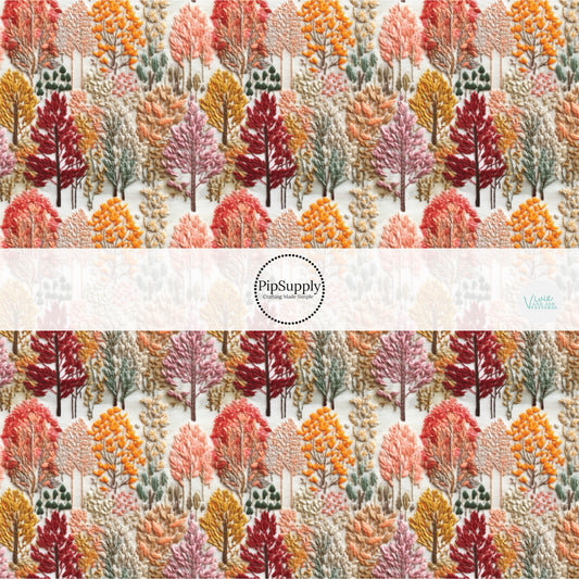 Burgundy, pink, yellow, green, and orange embroidered trees on cream fabric by the yard.