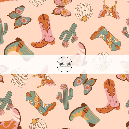 Cowgirl Boots and Cacti on Peach Colored Fabric by the Yard.