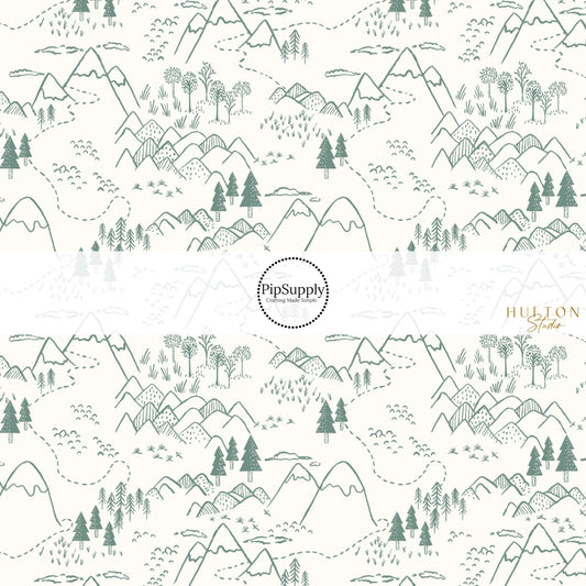 These fall themed fabric by the yard features dark green trees and mountains on cream. This fun autumn themed fabric can be used for all your sewing and crafting needs! 