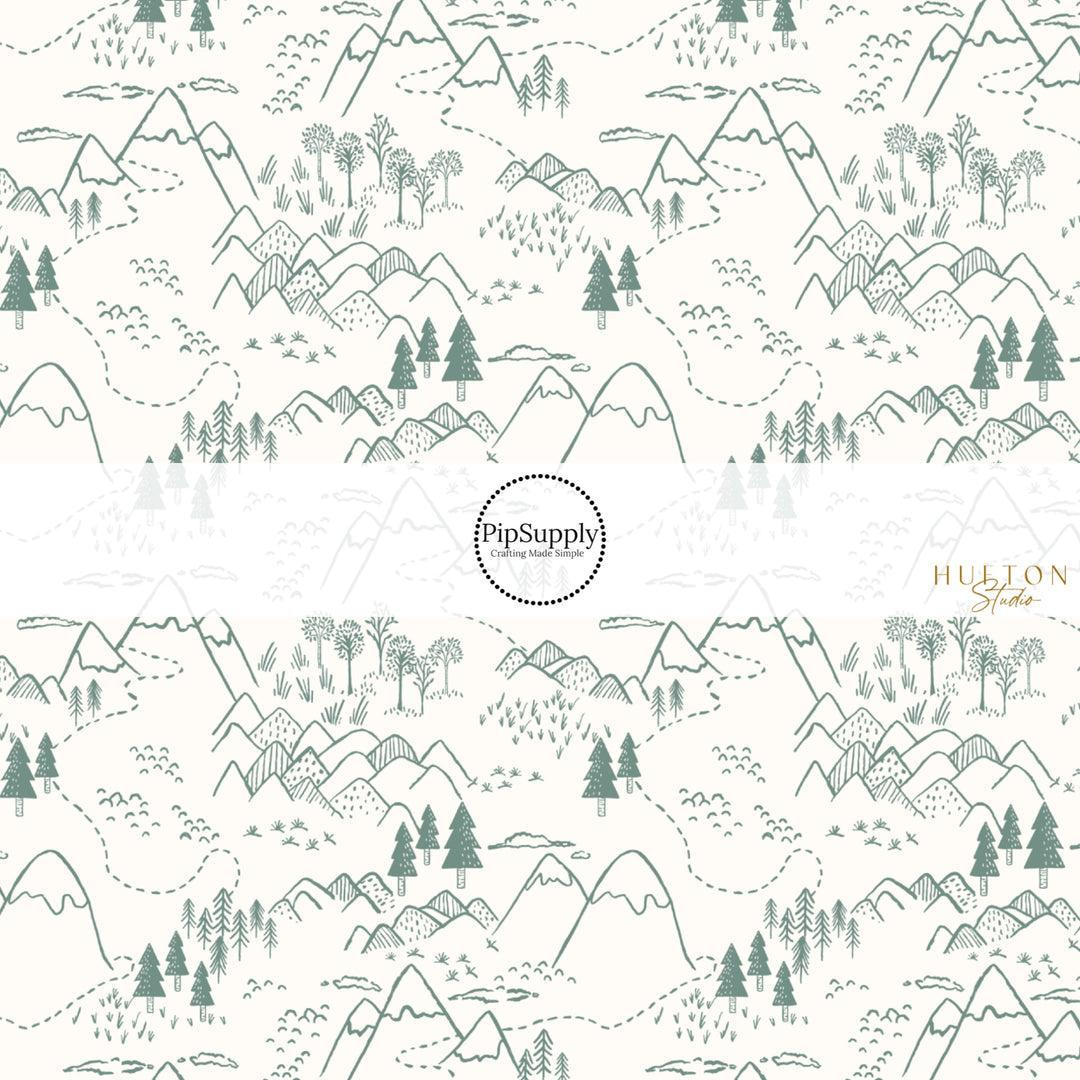 These fall themed fabric by the yard features dark green trees and mountains on cream. This fun autumn themed fabric can be used for all your sewing and crafting needs! 