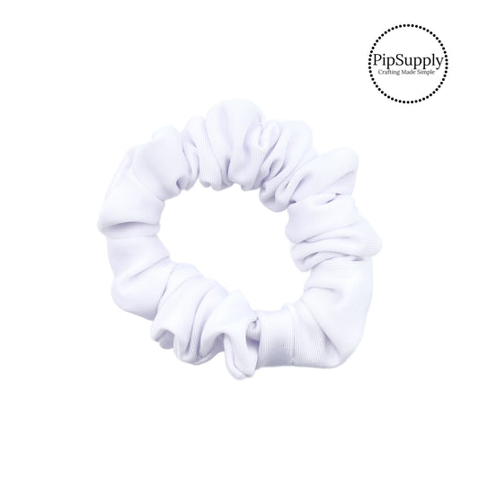 These white swim scrunchies have a two layer swimsuit fabric strip with edges that are securely folded and sewn providing a professional and high quality seam. Fabric is thick high quality not coarse or stiff with elastic band sewn inside for stretch-ability. Pattern visible on all sides. 