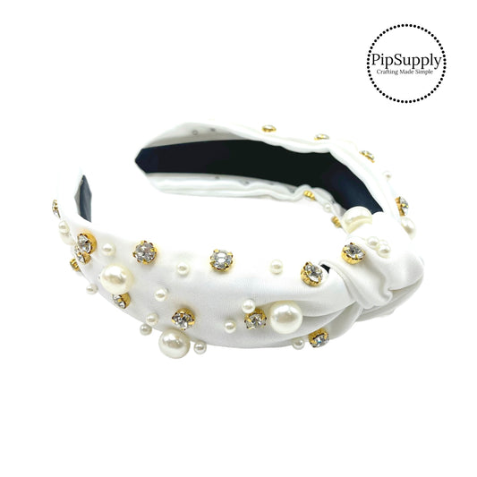 These embellished headbands with pearls and rhinestones are a stylish hair accessory having the look of a knotted headwrap and the on and off ease of a headband. Made with thick high quality fabric these headbands are a perfect simple and fashionable answer to keeping your hair back!