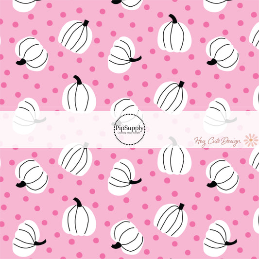 These Halloween themed pink fabric by the yard features white pumpkins surrounded by tiny pink dots on light pink. This fun spooky themed fabric can be used for all your sewing and crafting needs! 