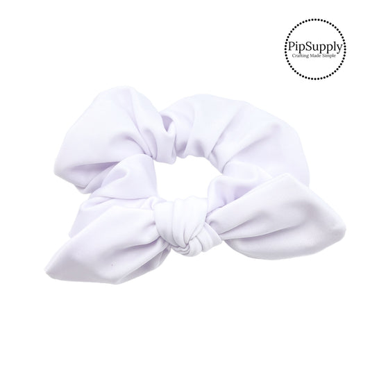 These white swim scrunchies have a two layer swimsuit fabric strip with edges that are securely folded and sewn providing a professional and high quality seam. Fabric is thick high quality not coarse or stiff with elastic band sewn inside for stretch-ability. Pattern visible on all sides. Bow comes pre-tied on scrunchie however is removable to be available as separate bow.