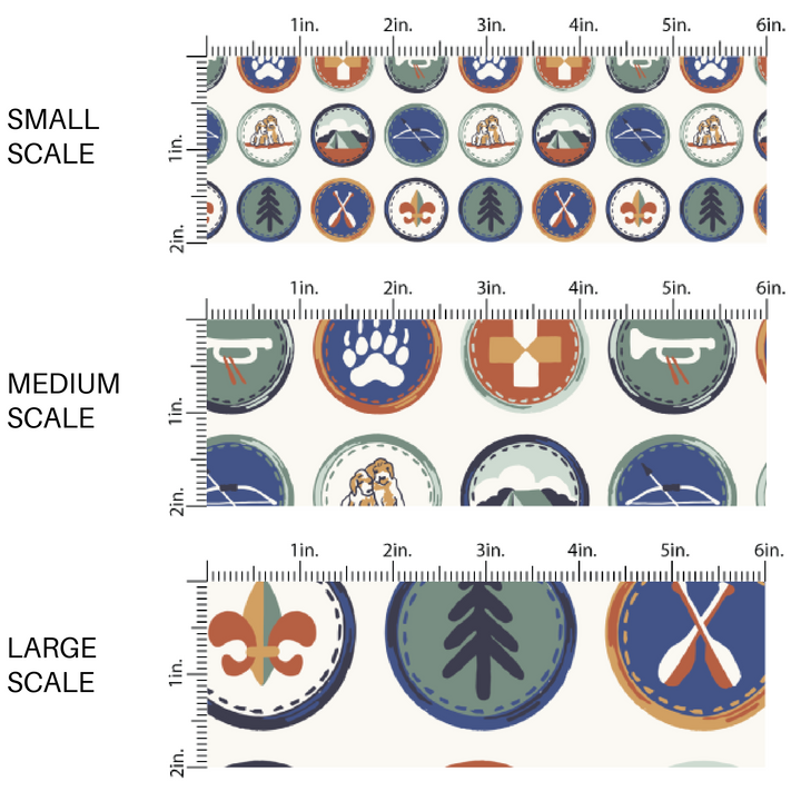 This scale chart of small scale, medium scale, and large scale of these fall themed fabric by the yard features outdoor wilderness explorer badges in green, blue, and orange on cream. This fun autumn themed fabric can be used for all your sewing and crafting needs!