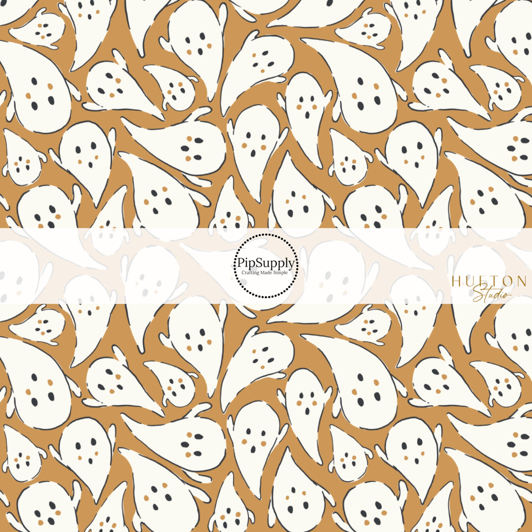 These Halloween themed pattern fabric by the yard features the following design elements: white ghost on golden brown. This fun spooky themed fabric can be used for all your sewing and crafting needs!