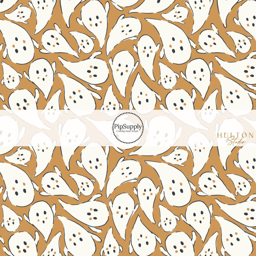 These Halloween themed pattern fabric by the yard features the following design elements: white ghost on golden brown. This fun spooky themed fabric can be used for all your sewing and crafting needs!