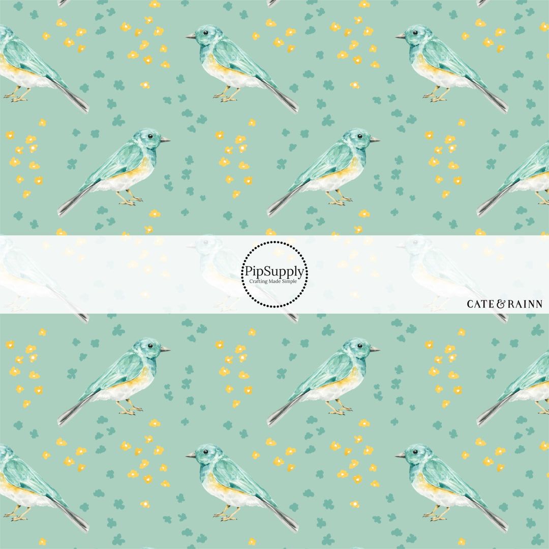 These spring fabric by the yard features birds and tiny flowers on aqua. This fun pattern fabric can be used for all your sewing and crafting needs!