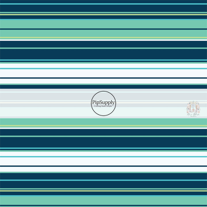 Tropical stripes in aqua, teal, light blue, light green, and dark navy fabric by the yard.