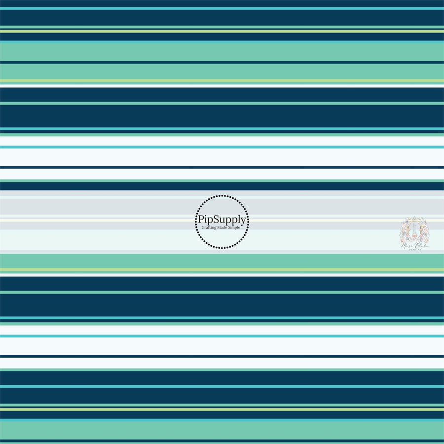 Tropical stripes in aqua, teal, light blue, light green, and dark navy fabric by the yard.