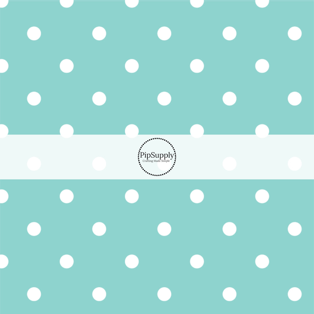 This celebration fabric by the yard features white dots on aqua. This fun themed fabric can be used for all your sewing and crafting needs!