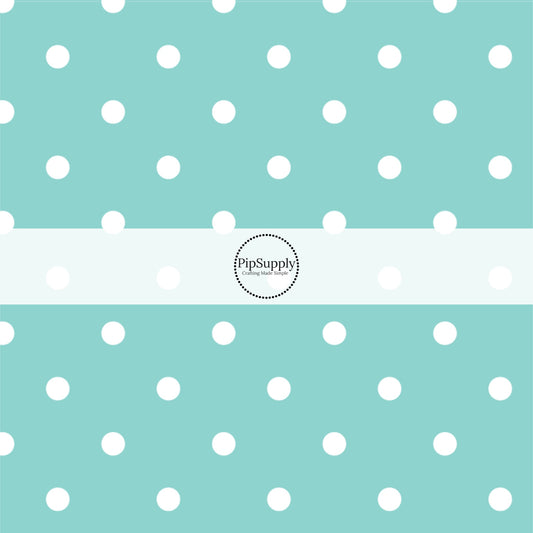 This celebration fabric by the yard features white dots on aqua. This fun themed fabric can be used for all your sewing and crafting needs!