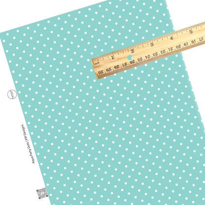 These celebration faux leather sheets contain the following design elements: white dots on aqua. Our CPSIA compliant faux leather sheets or rolls can be used for all types of crafting projects.