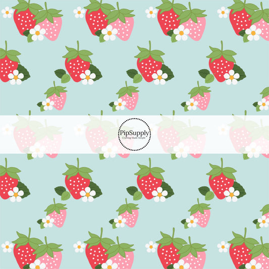This summer fabric by the yard features strawberries and white flowers on light blue. This fun themed fabric can be used for all your sewing and crafting needs!