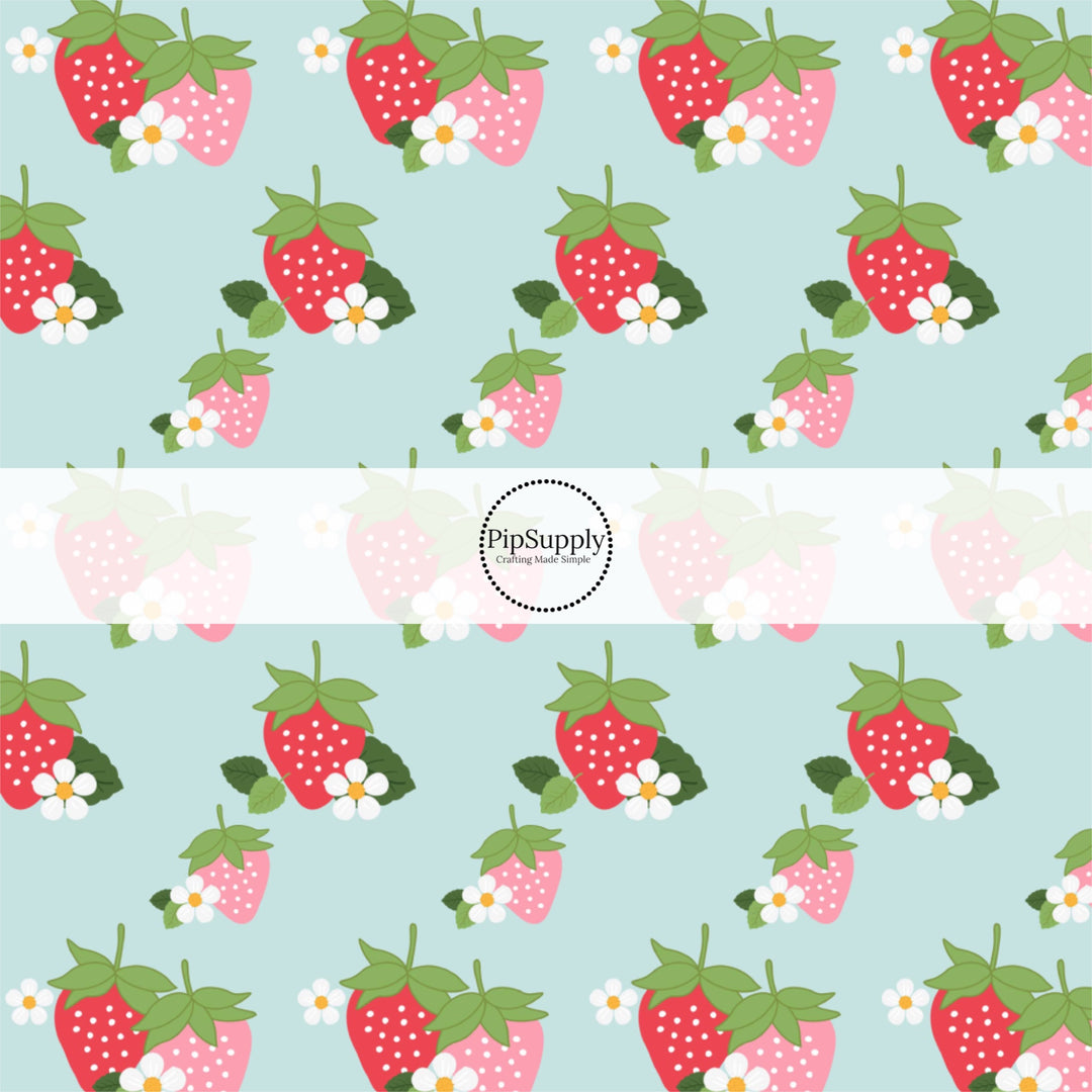 This summer fabric by the yard features strawberries and white flowers on light blue. This fun themed fabric can be used for all your sewing and crafting needs!