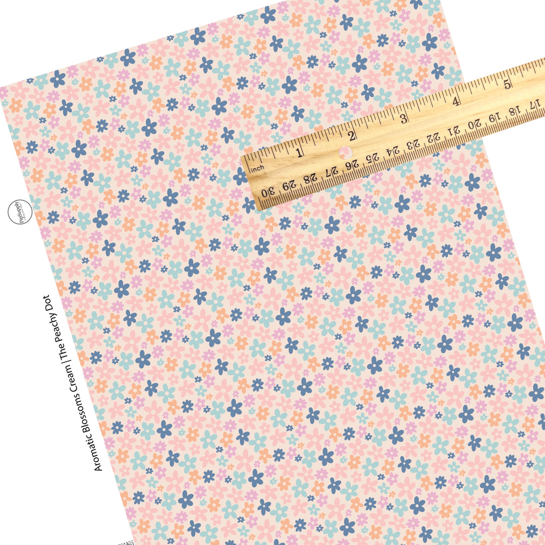 These spring floral pattern themed faux leather sheets contain the following design elements: pink, orange, and blue flowers on cream. Our CPSIA compliant faux leather sheets or rolls can be used for all types of crafting projects.