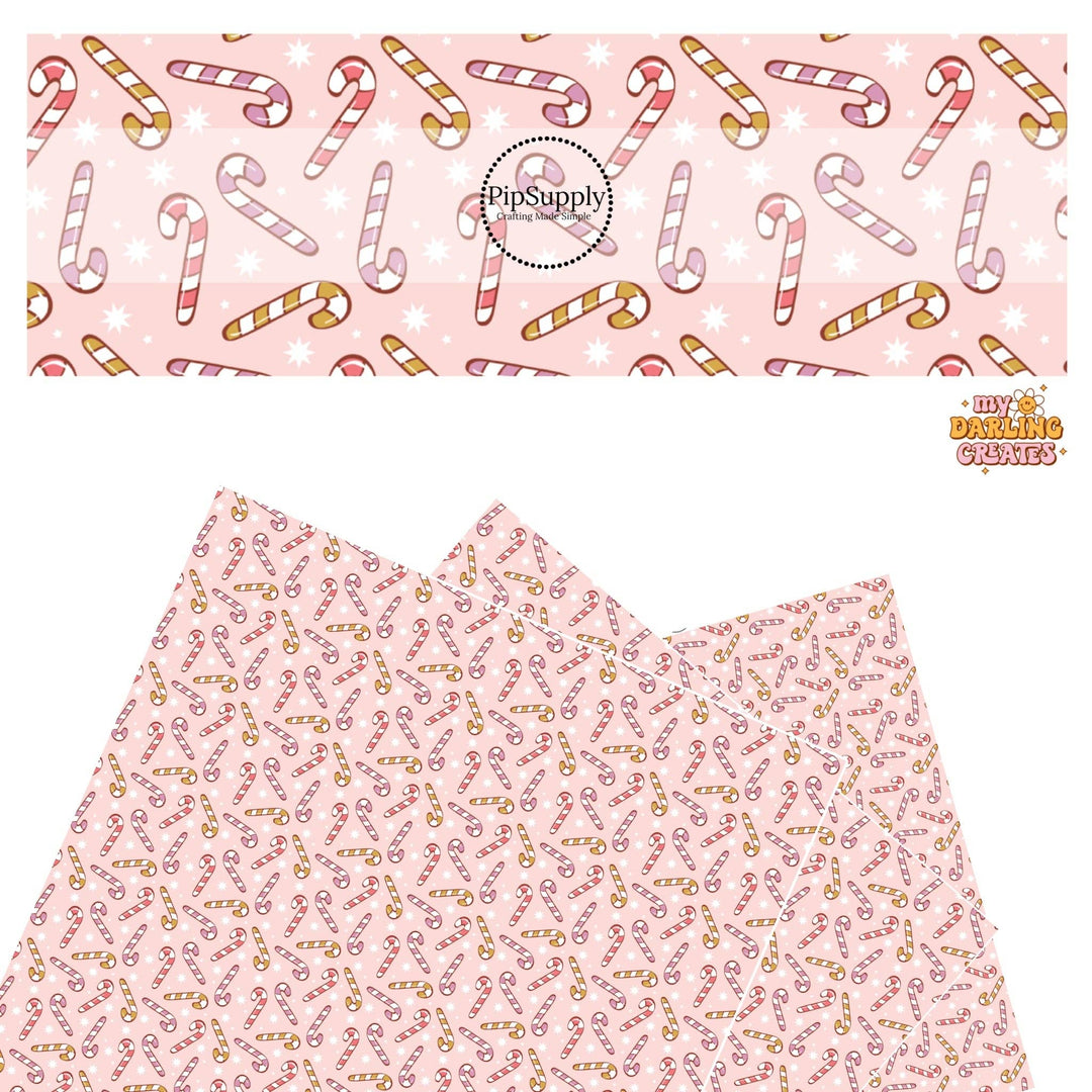 Assorted Candy Canes on Baby Pink Faux Leather Sheets
