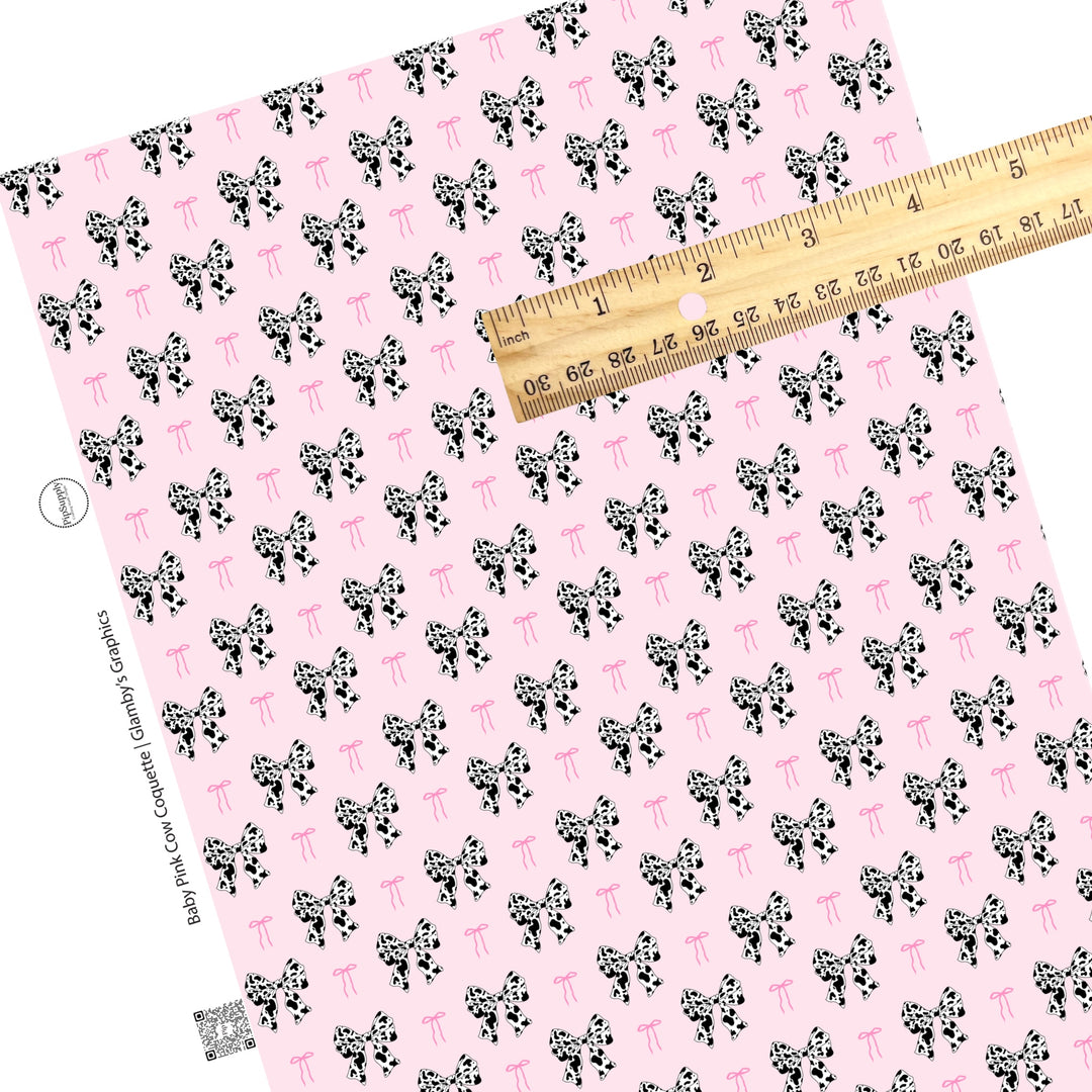 These spring pattern themed faux leather sheets contain the following design elements: pink bows and cow pattern bows on light pink. Our CPSIA compliant faux leather sheets or rolls can be used for all types of crafting projects.