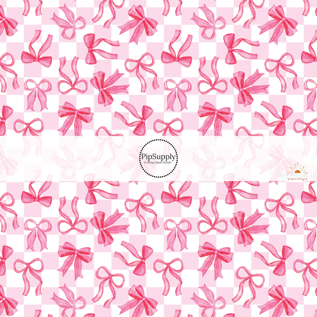 This holiday fabric by the yard features pink bows on checker pattern. This festive pattern fabric can be used for all your sewing and crafting needs!