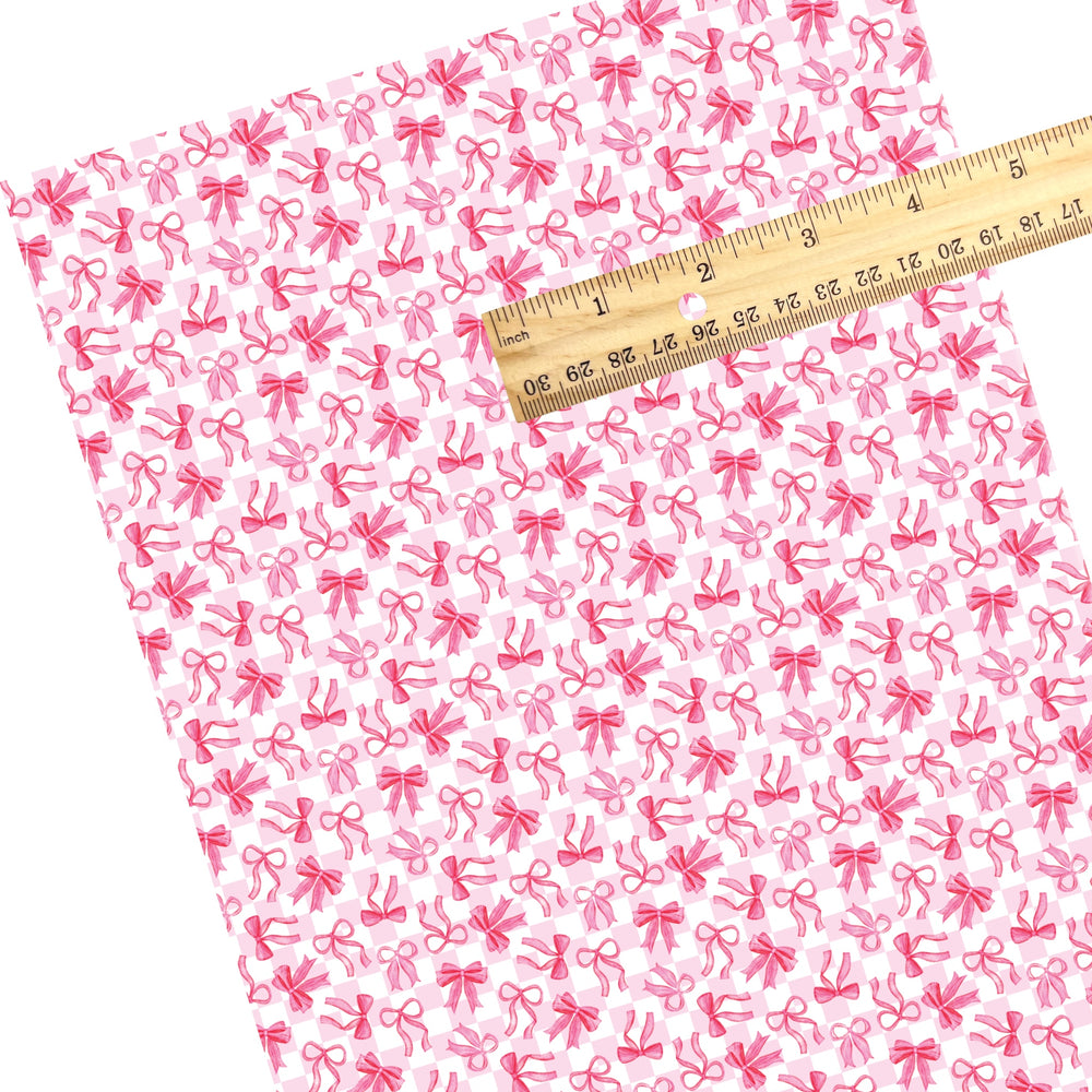 These holiday faux leather sheets contain the following design elements: pink bows on checker pattern. Our CPSIA compliant faux leather sheets or rolls can be used for all types of crafting projects.